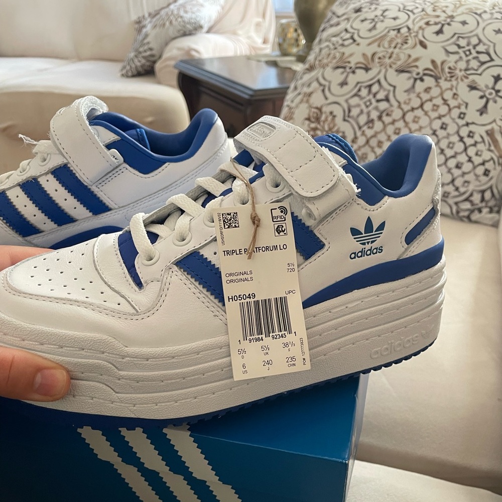 Adidas Womens “Triple Platforum Lo” sneakers.